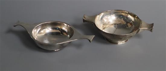 Two plain Scottish silver quaichs, Edinburgh, 1892 and 1929, largest 14.3cm.